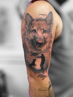 a man with a wolf tattoo on his arm