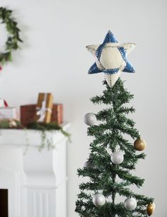 a small christmas tree with ornaments on it