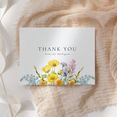 a thank card with watercolor flowers on it