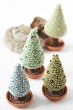 small crocheted trees sitting on top of each other