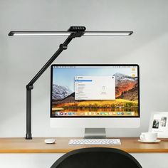 a desktop computer sitting on top of a wooden desk