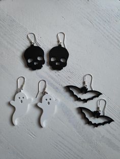 Celebrate the magic of Halloween with our delightful Halloween Charm Earrings! These 3D printed earrings feature iconic spooky designs like pumpkins, ghosts, bats, witch hats, black cats, and skulls, perfect for adding a playful, eerie touch to your outfit. Crafted with Care and Style Each pair of earrings is meticulously crafted to bring out the details of these beloved Halloween symbols. Whether you want to embrace the festive fun with a grinning pumpkin or exude mystery with a sleek black cat Spooky Jewelry, 3d Printed Earrings, Printed Earrings, Halloween Symbols, Ghost Witch, Bat Earrings, Pumpkin Ghost, Halloween Charms, Spooky Designs