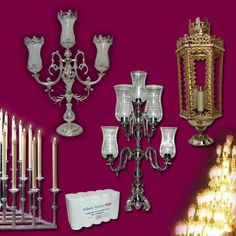 many different types of candles and holders on a purple background with white lights in the middle