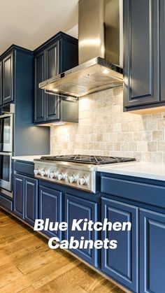 a kitchen with blue cabinets and white counter tops is pictured in this image from the front view