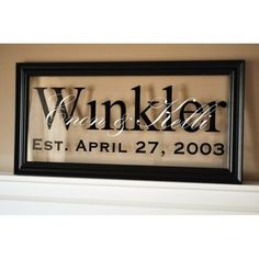 a framed sign that says wanker est, april 27, 2003 on the wall