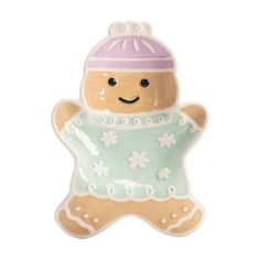 a ceramic ginger ornament with a pink hat and sweater on it's chest