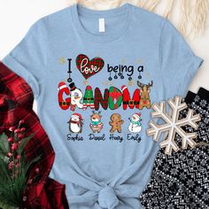 I love Being A Grandma Christmas CTL01 T-ShirtGreat as Birthday gifts or Holiday presents. This adorable item can be designed upon anyone's wish with any title. Please enter: 1. Nickname. ie. Grandma, Nana, Mimi, ...etc. 2. Kids' Names wanted on the shirt (Names separated by commas) All items are made to order. * Please be aware that the physical product's colors may differ slightly from the mockup. Brand: Gildan Classic unisex cut makes this easy to fit the body. Material: Heavyweight fabric Sp Shirt Names, Being A Grandma, Grandma Christmas, Make Your Own Shirt, Custom Made T Shirts, Grandmas Christmas, Grandma Shirt, Flat Collar, Couple Tshirts