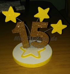 a cake that has the number fifteen on it and five stars in front of it