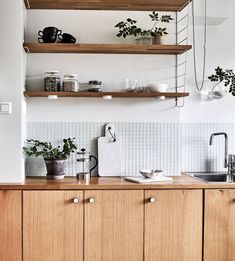 the kitchen is clean and ready for us to use it's natural wood countertops