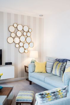 a living room filled with furniture and a flat screen tv