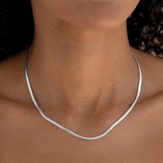 This stunning silver statement necklace boasts a sleek flat snake chain design that adds a touch of modern elegance to any outfit, whether worn alone or layered. The necklace is crafted in sterling silver. Snake chain has a width of 2.9mm Necklace has an adjustable length and can be set between 16” to 18” long Flat Silver Necklace, Snake Chain Necklace Silver, Jewelry Silver Necklaces, Outfit Bord, Silver Necklace Aesthetic, Necklace Layering Silver, Silver Chains For Women, Farewell Dance, Silver Jewellery Aesthetic