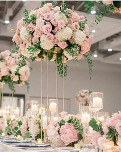 the centerpieces are filled with pink and white flowers