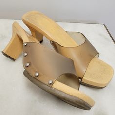 Vintage Y2k Slip on heels! Gray/clear Mules with plastic chunky wood look base! marked a size 9 heel tip is very worn, dirt between strap edge and shoe, left shoe missing one screw.  Insole: 10 1/16" Heel: 3" Platform: 15/16" 14 oz. Heels Clear, Y2k Heels, Clear Mules, Slip On Heels, Clogs And Mules, Clogs Shoes, Clear Plastic, Mule, Vintage Y2k