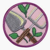 a pink patch with gardening tools on it