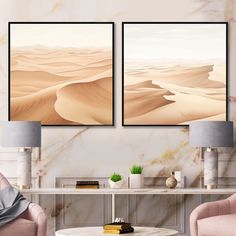 two paintings are hanging on the wall above a coffee table in a living room with pink chairs