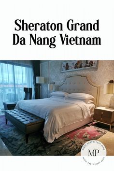 there is a bed with white sheets and pillows in the room that says sheraton grand da nang vietnam