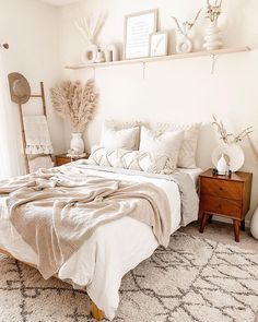 a bedroom with white walls and neutral decor