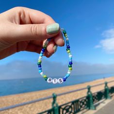 Handmade, totally exclusive and one-of-a-kind beaded BTS Gay pride flag bracelet! With beads in shades of blue, green and white this bracelet is inspired by the gay man pride flag!  Please note beads may have very small imperfections - the bracelets in the pictures are the exact ones you will receive so please message me if you have any questions! I only make one of each of my pieces so there are no size options, however if you love this design but think you would need it to be any bigger/smaller please message me or leave a note upon purchase and I would be happy to accommodate free of charge. *PLEASE NOTE* Of course this would result in either the addition or removal of some beads depending on the alteration but I will always keep this in line with the original design. Gay Bracelets, Pride Flag Bracelet, Gay Pride Bracelet, Bts Bracelet, Flag Bracelet, Bracelet With Beads, Pride Bracelet, Gay Pride Flag, Hope Necklace