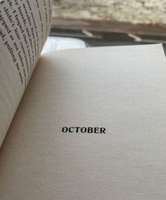 an open book with the word october printed on it