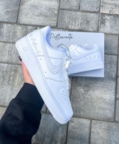 Blinged out bridal Air Force 1 sneakers personalized for the brides special day 👰🏻 **PLEASE READ LISTING CAREFULLY**  SNEAKERS: This listing if for Nike Air Force 1, if you would like something different please message me :) Personalization section please add: *your name  *date of wedding *if you want them without any customization please type (no customization) NOTE: A proof of your lettering will be sent to you within 72 hours of purchasing, please check your messages to approve image. If seller does not hear back within another 48 hours will proceed with shoes accordingly.  Price breakdown: *Outer Side/Seam $245      -This option includes all white pearls on the 2 outer symbols, the outer 2 side seams, pearls going up the back heel strip and the back seam & lettering of your choice. R Pearl Nike Air Force, Wedding Nike Air Force, Nike Bride Shoes, Bride Air Force Ones, Custom White Wedding Sneakers, White Low-top Wedding Shoes For Bride, Customizable White Wedding Sneakers, White Sneakers With Laces For Bridal Shower, Customizable White Sneakers For Wedding