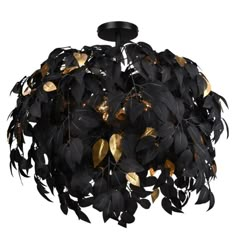 a black and gold leaf chandelier hanging from a ceiling fixture with leaves on it