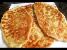 three quesadillas sitting on top of a white plate