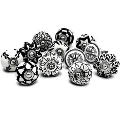 several black and white ceramic knobs with flowers on them, all in different sizes