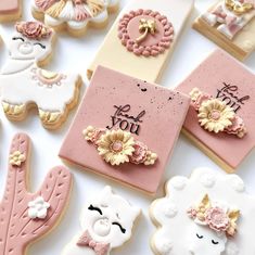 some decorated cookies are laying on a table