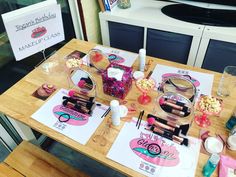 the table is set up with makeup and other items for making lip glosses on it