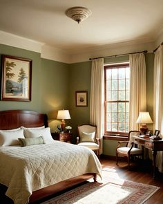 a bed sitting in a bedroom next to two lamps on either side of a window