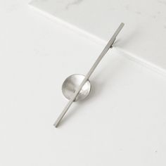 a spoon sitting on top of a white counter