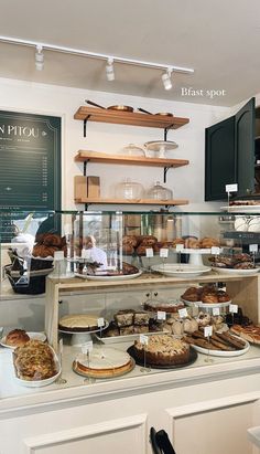 a bakery filled with lots of different types of baked goods and desserts on display