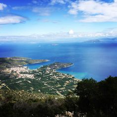 an aerial view of the ocean, land and water from a high point of view