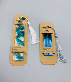 two packaged items with tassels on them