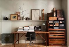 a room with a desk and shelves filled with books