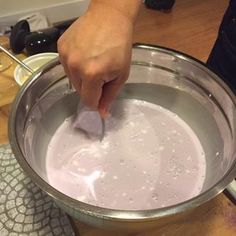 a person is mixing something in a bowl