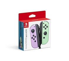 two nintendo switch controllers in packaging on a white background, one is green and the other is pink