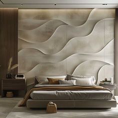 a large bed sitting in a bedroom next to a wall covered in wavy paper designs