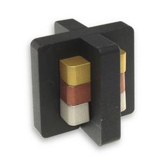 three different colored blocks in a black holder