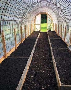 the inside of a greenhouse with plants growing in it