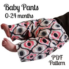 the baby pants are designed to look like an abstract design, with black and pink circles on