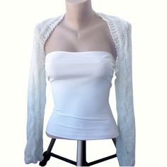 This unique bolero is beautiful complement to your wedding, or special, or both, daytime and evening dress. 100% handmade, unique, feminine and pretty. It is hand knitted and quite strecthy from 100% polyester yarn. Sizes:  S-M FOR back width from armpit to armpit: up to 33 cm/13 in Sleeve edge to sleeve edge approximately : 150 cm / 59 in Sleeve from armpit to elbow: 43 cm / 17 in M-L FOR back width from armpit to armpit: up to 38 cm/15 1/2 in Sleeve edge to sleeve edge approximately : 155 cm / 61 in Sleeve from armpit to elbow: 43 cm / 17 in L-XL FOR back width from armpit to armpit: up to 43 cm/18 in Sleeve edge to sleeve edge approximately : 160 cm / 63 in Sleeve from armpit to elbow: 43 cm / 17 in XL-XXL FOR back width from armpit to armpit: up to 53 cm/22 in Sleeve edge to sleeve edg Long Sleeve Shrug For Spring Weddings, Bolero Sleeves, White Bolero, Dress With Bolero, Wedding Shrug, Shrugs And Boleros, Yarn Sizes, Polyester Yarn, Cropped Jacket