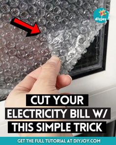 someone is removing an electrical bill from their window with the words cut your electricity bill w / this simple trick get the full video at diyjoy com