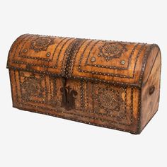 an old wooden chest with decorative carvings on it