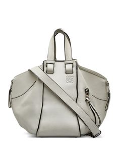 circa 2016 white calf leather signature debossed Anagram motif two top handles detachable shoulder strap lobster claw fastening main compartment front zip-fastening pocket gold-tone hardware Condition: GOOD. This previously owned and used item is in good condition with minimal signs of use. This may include fading of material or plating and scratches. Purchasing this item continues its narrative and reduces the environmental impact by avoiding the use of new resources needed to make the product from scratch, such as water, materials and electricity, and avoiding additional manufacturing impact. Learn more about what makes a product Conscious on our Conscious Criteria page Hammock Bag Loewe, Small Hammock, Hammock Bag, Loewe Puzzle, Loewe Bag, Accessories Bags Purses, Women Leather, Small Shoulder Bag, Leather Handles