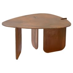 an oval shaped table with two legs and a curved top, made out of metal