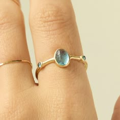 Viaggio Aquamarine Ring Unique Bezel Settings, Oval Gemstone Ring In Recycled Gold, Oval Gemstone Ring With Recycled Gold, Oval Cabochon Topaz Ring For Anniversary, 14k Gold Rings With Bezel Set Oval Cabochon, Elegant Blue Topaz Cabochon Ring, 14k Gold Rings With Bezel Setting And Oval Cabochon, Anniversary Oval Cabochon Topaz Ring, Oval Aquamarine Birthstone Ring Fine Jewelry