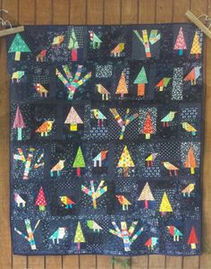 an image of a quilt hanging on the wall