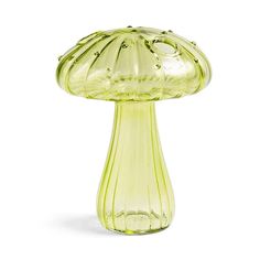 a yellow glass mushroom shaped object on a white background