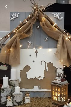 a nativity scene with candles and lights